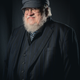 A portrait photo of acclaimed fantasy author George R.R. Martin